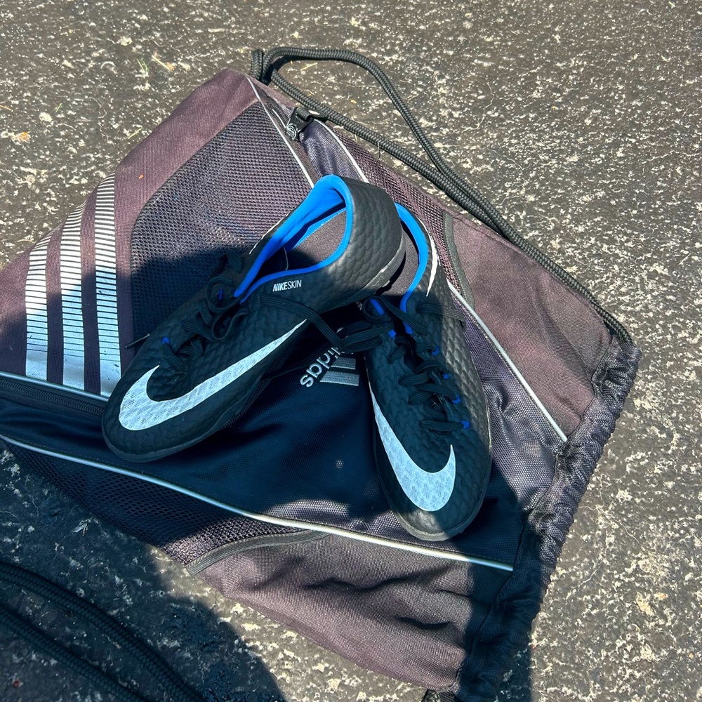Nike blue and black turf shoes